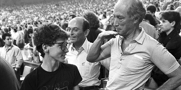 Former prime minister Pierre Trudeau shows how tall his eldest son Justin has grown in relation to himself during the seventh inning stretch at the Montreal Expos game in Montreal on April 20, 1987. Justin Trudeau may seem to be following in dad's footsteps as he prepares to seek the Liberal leadership, but he's really heading down a vastly different path into unknown territory. THE CANADIAN PRESS/Paul Chiasson